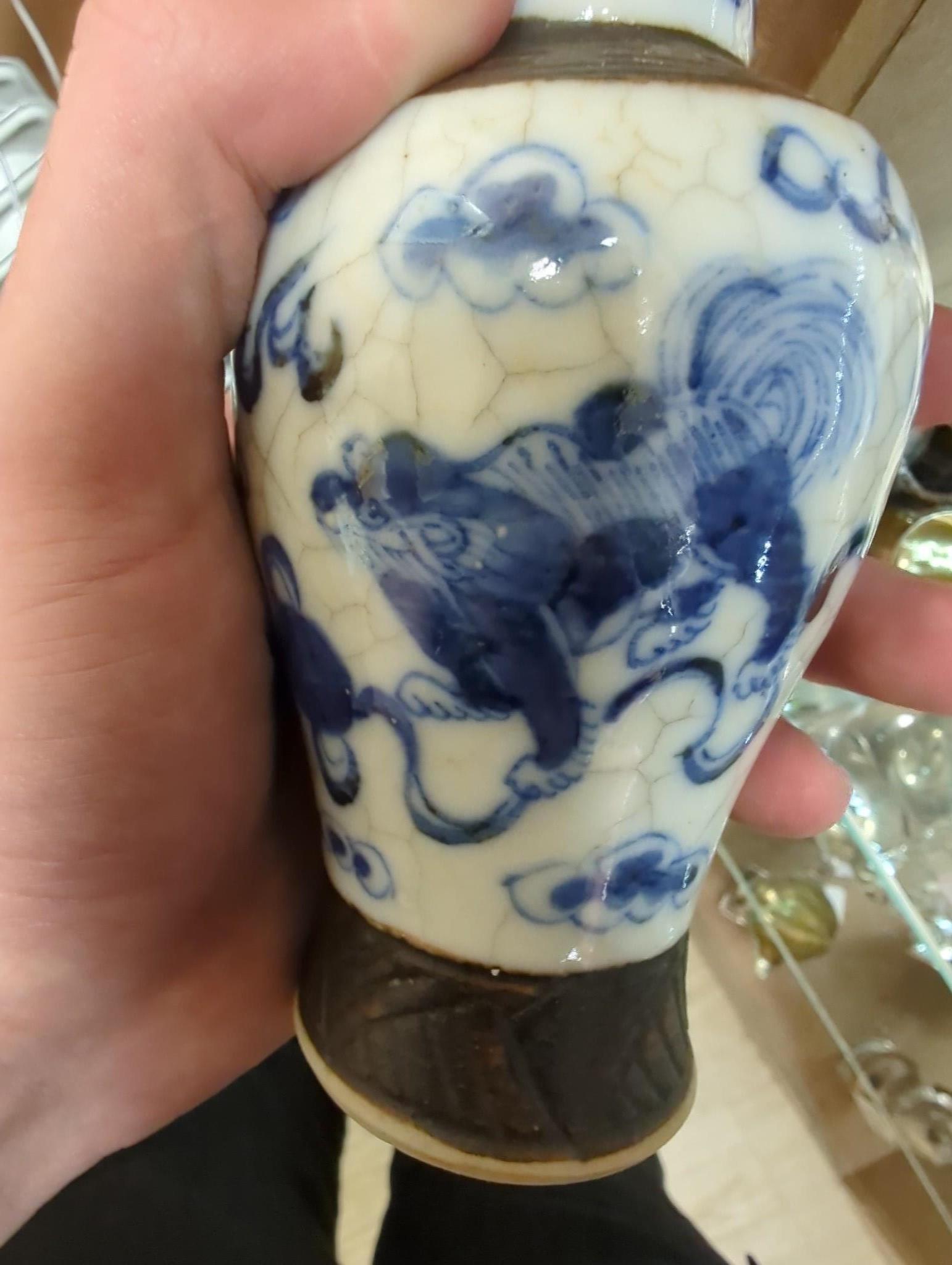 Three Chinese blue and white crackle glaze vases, a famille rose brush pot, late 19th/early 20th century, a crackle glaze ginger jar and a carved soapstone lion-dog (6)